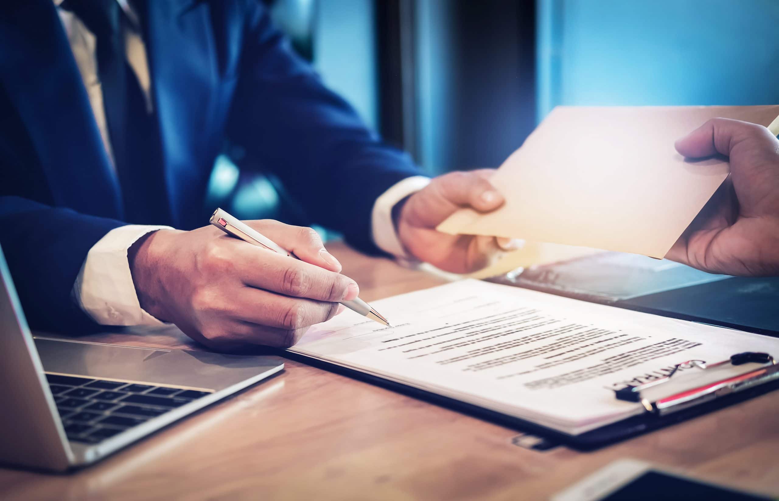 This is an image of a lung cancer patient or family member receiving financial compensation.