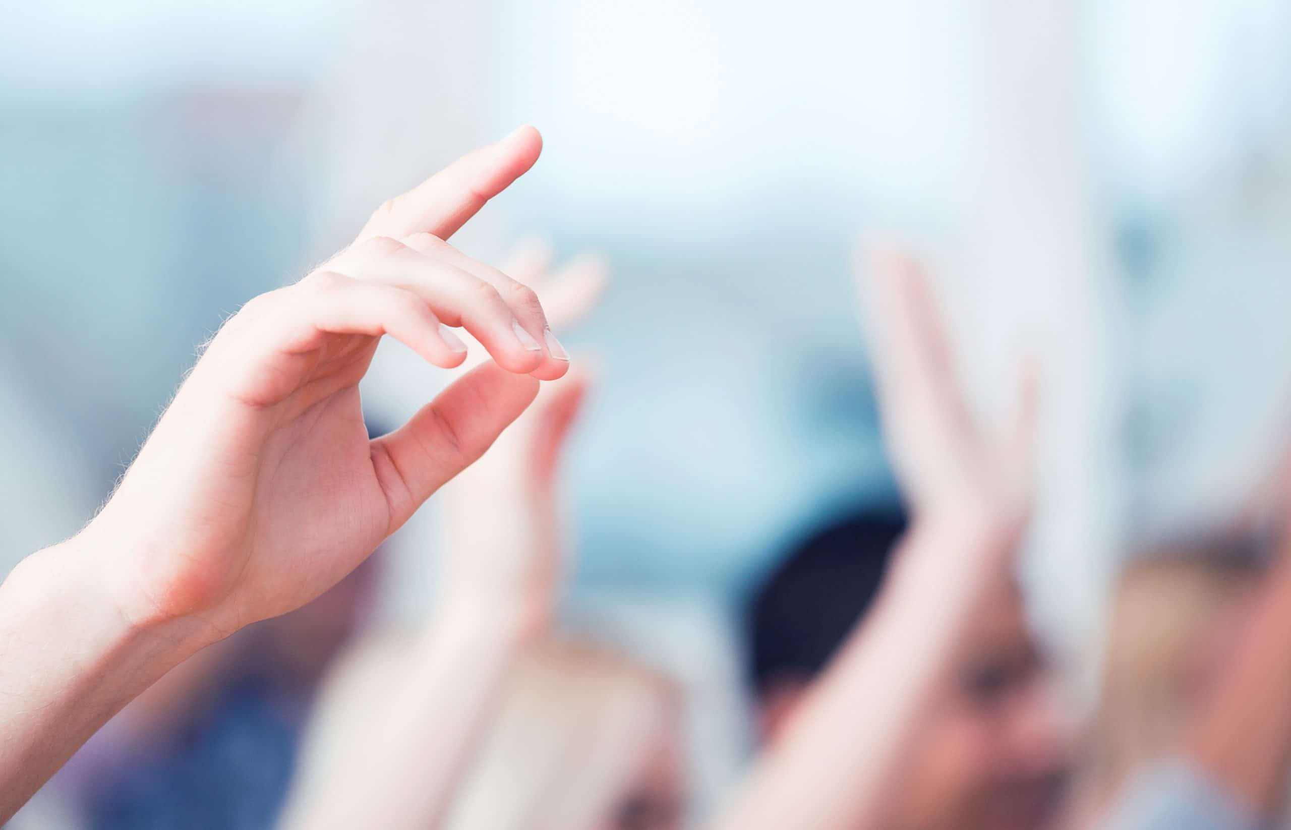 This is an image of a group of people asking questions.