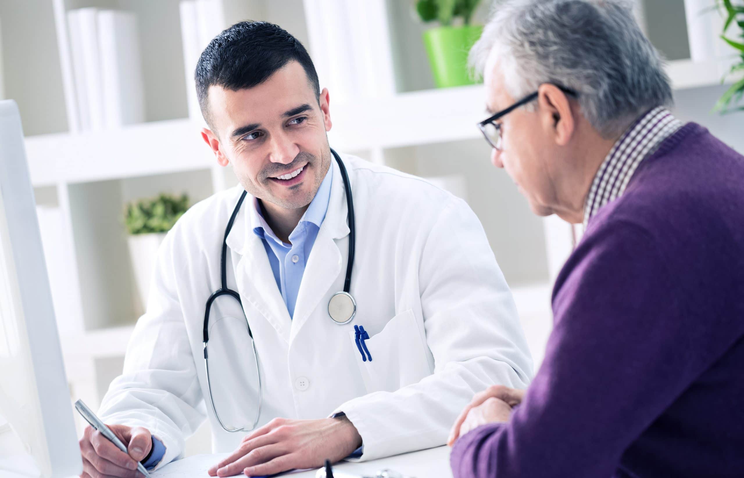 This is an image of a doctor and patient discussing the patients prognosis.