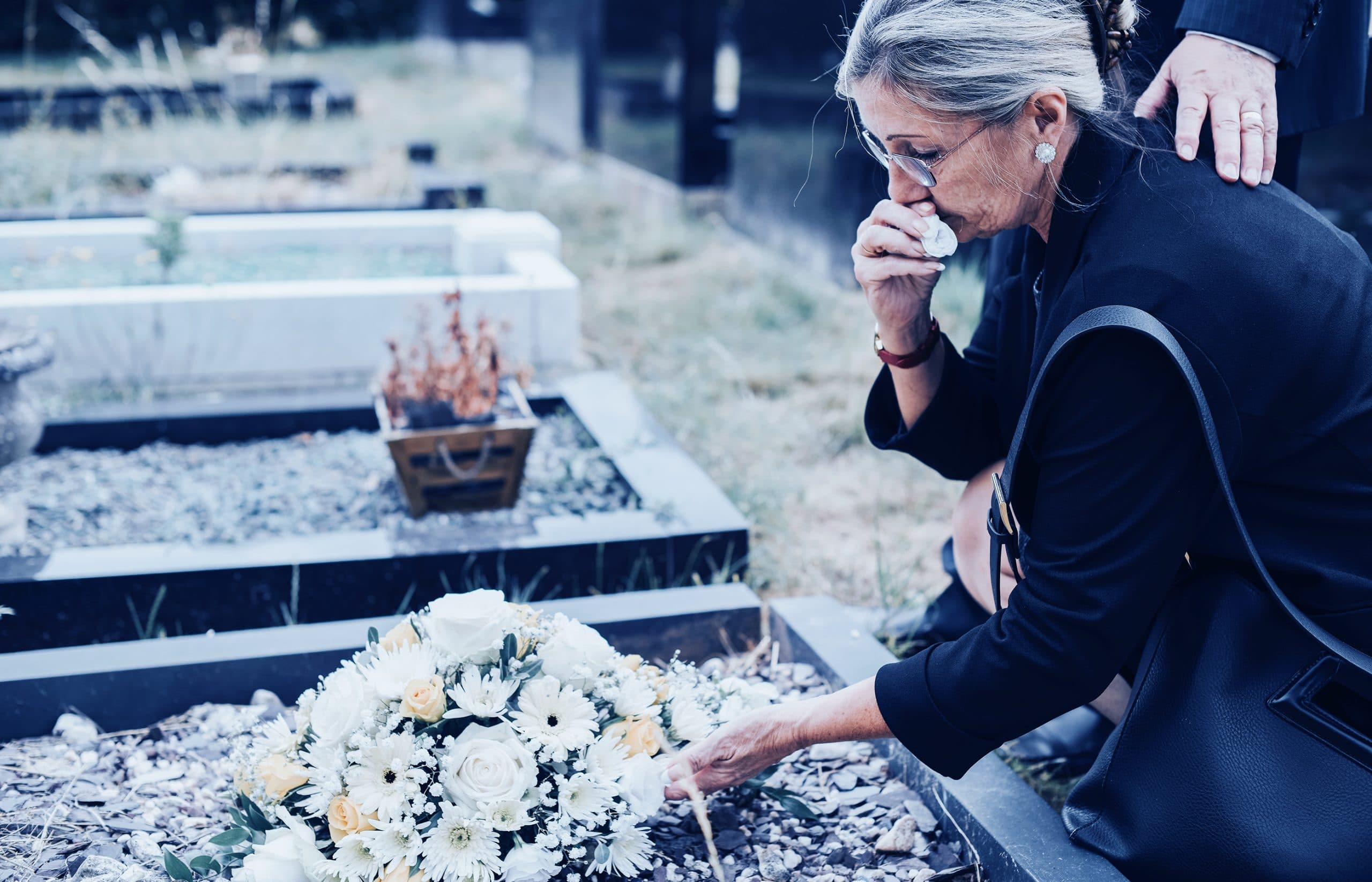 This is an image of a woman mourning the wrongful death of her spouse who has been affected by lung cancer.