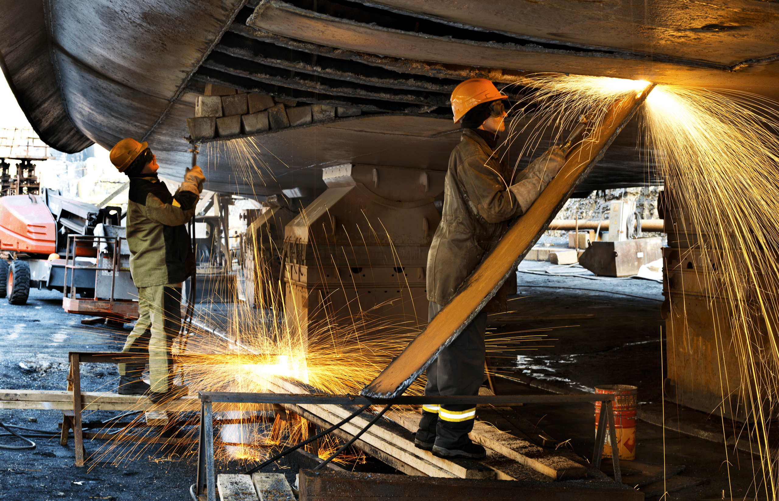 This is an image of two shipyard workers being exposed to asbestos.
