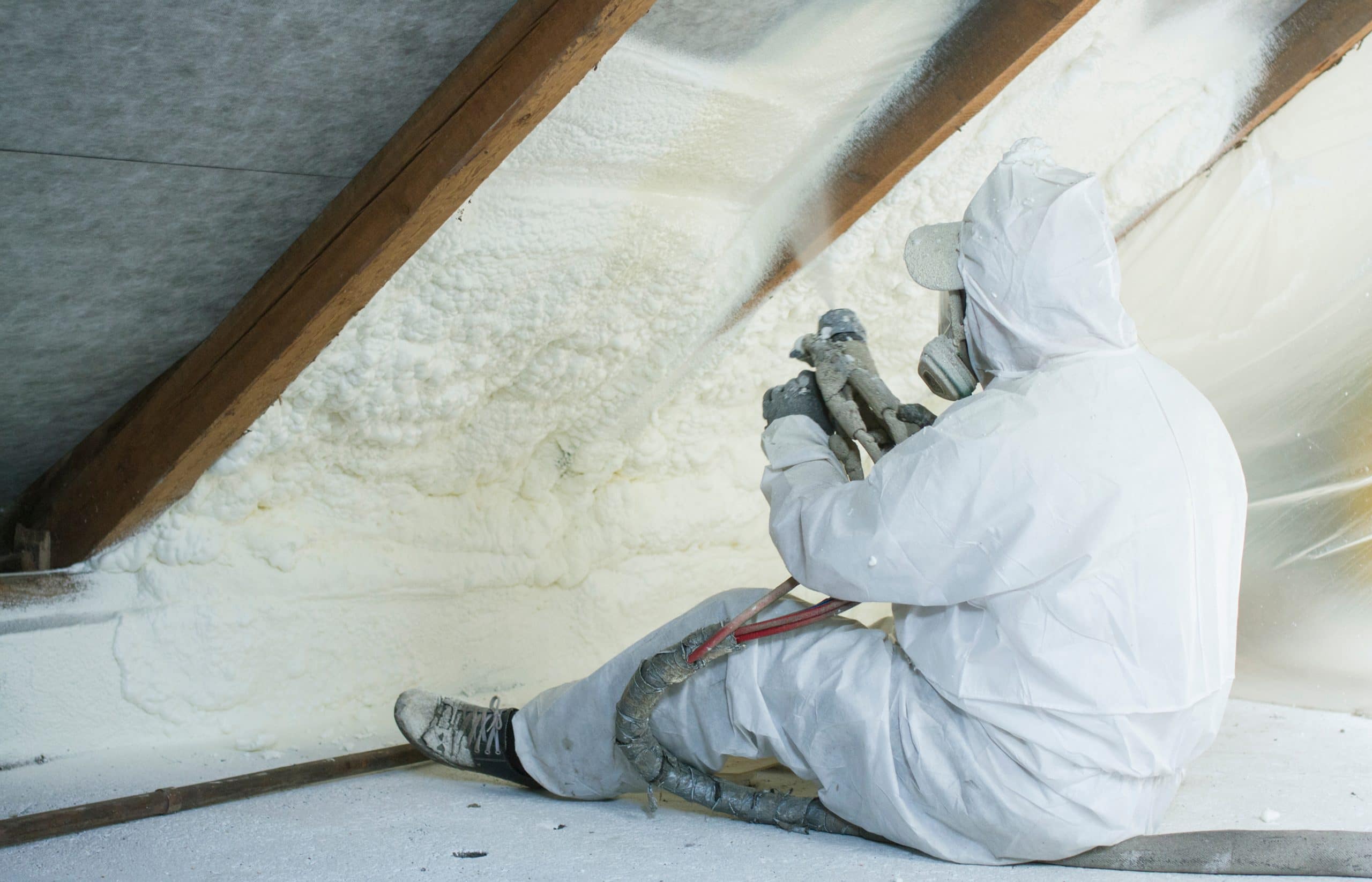 This is an image of an insulation worker potentially being exposed to asbestos.