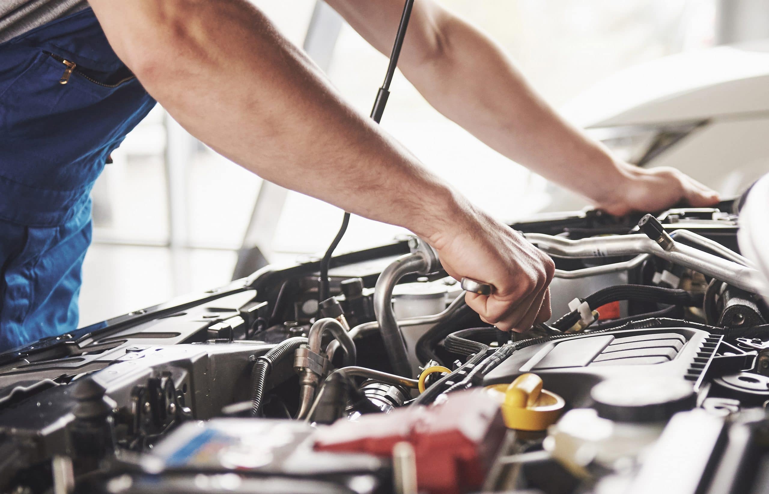 This is an image of a mechanic potentially being exposed to asbestos.