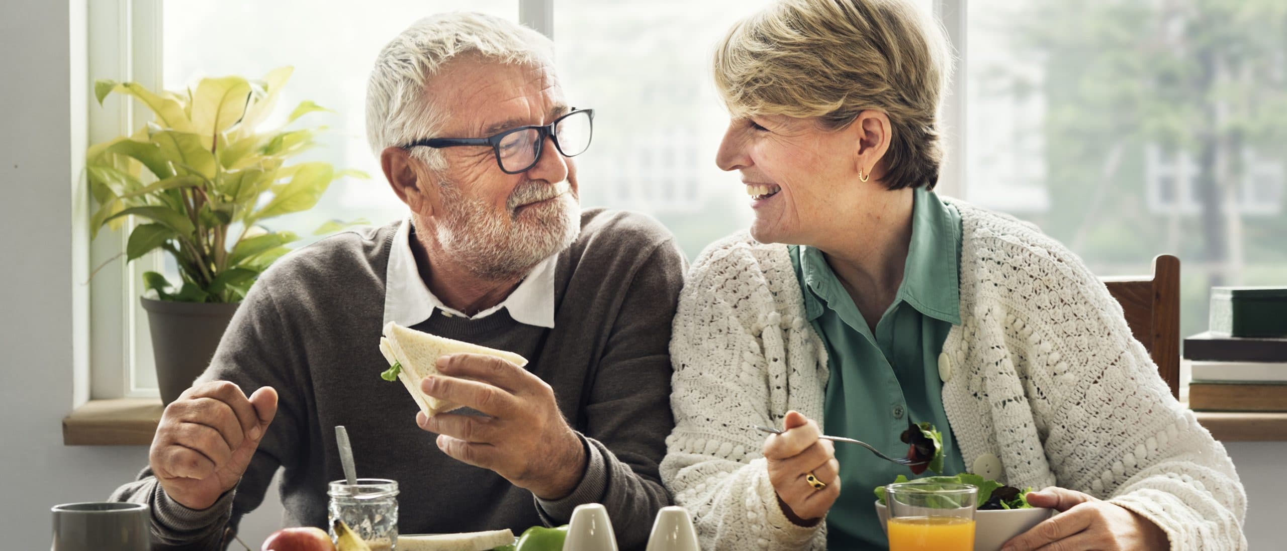 This is an image of two people eating healthy and improving their prognosis.