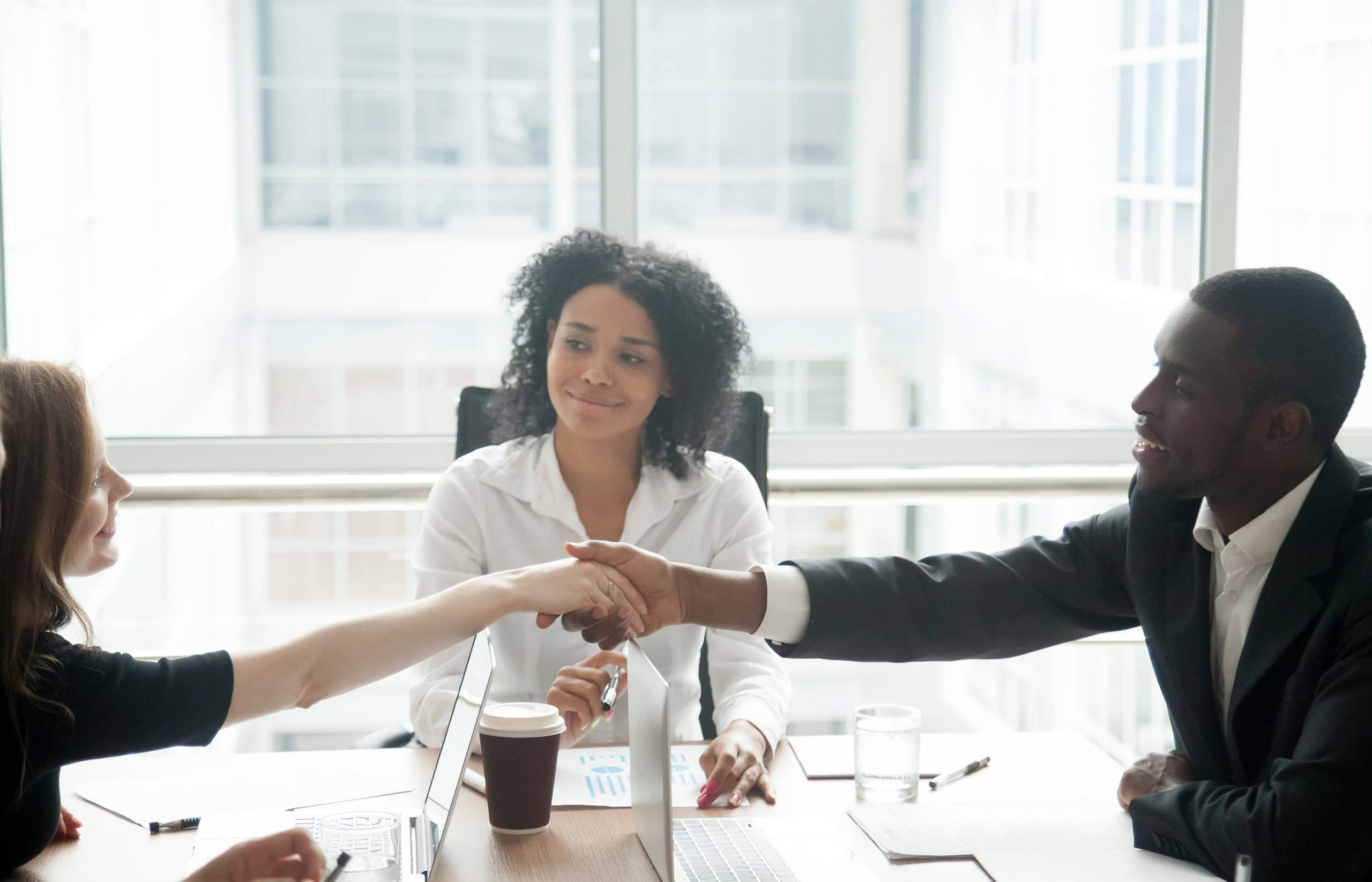 This is an image of a patient finding an attorney and shaking hands with a lawyer.