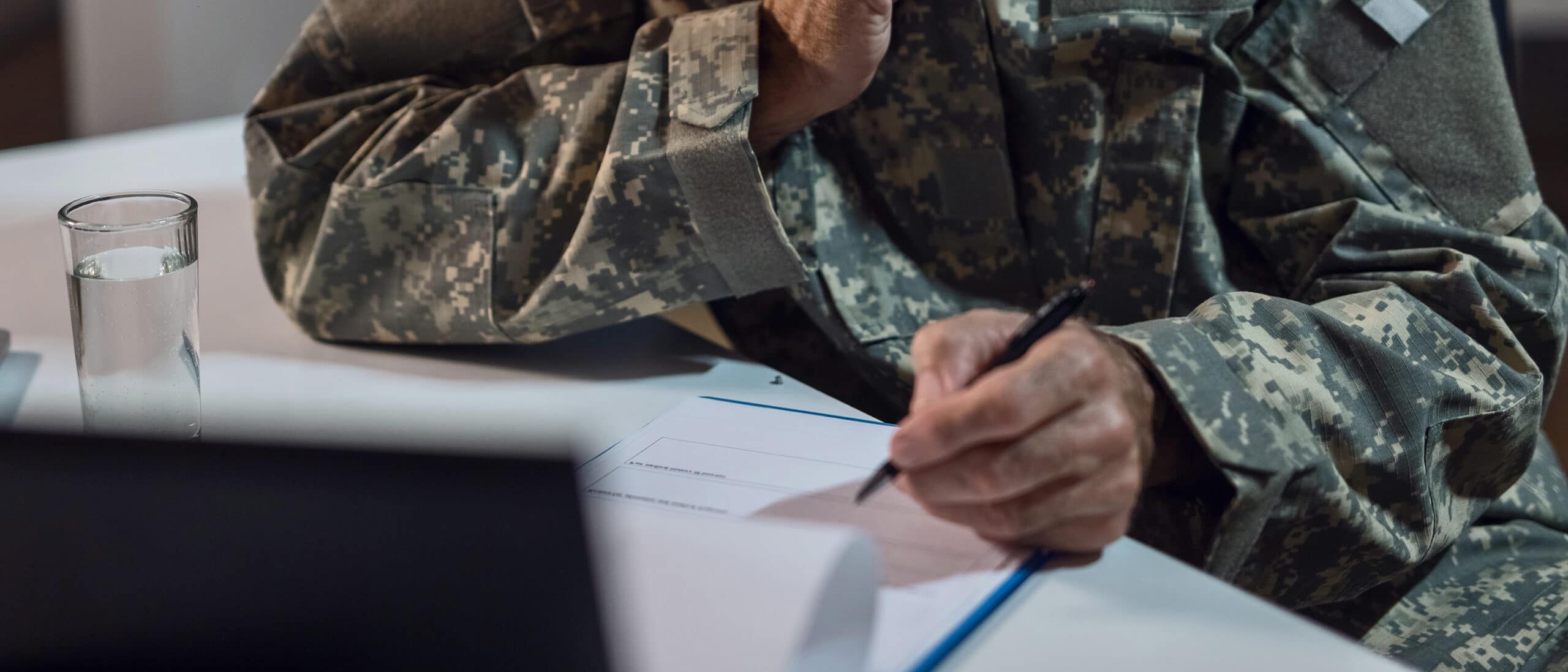 This is an image of a veteran filling out their VA benefits.