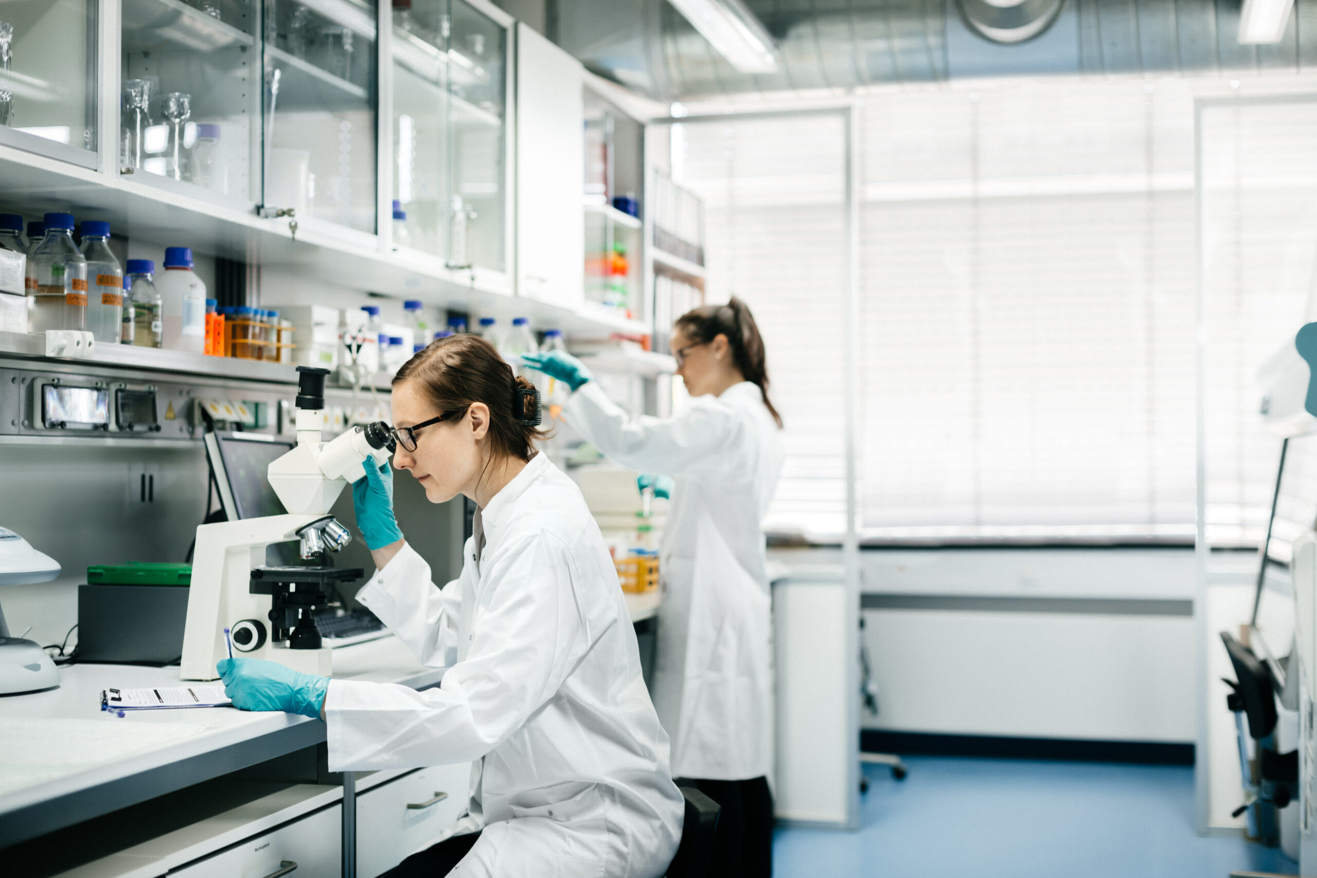 Two female scientists working in a modern laboratory