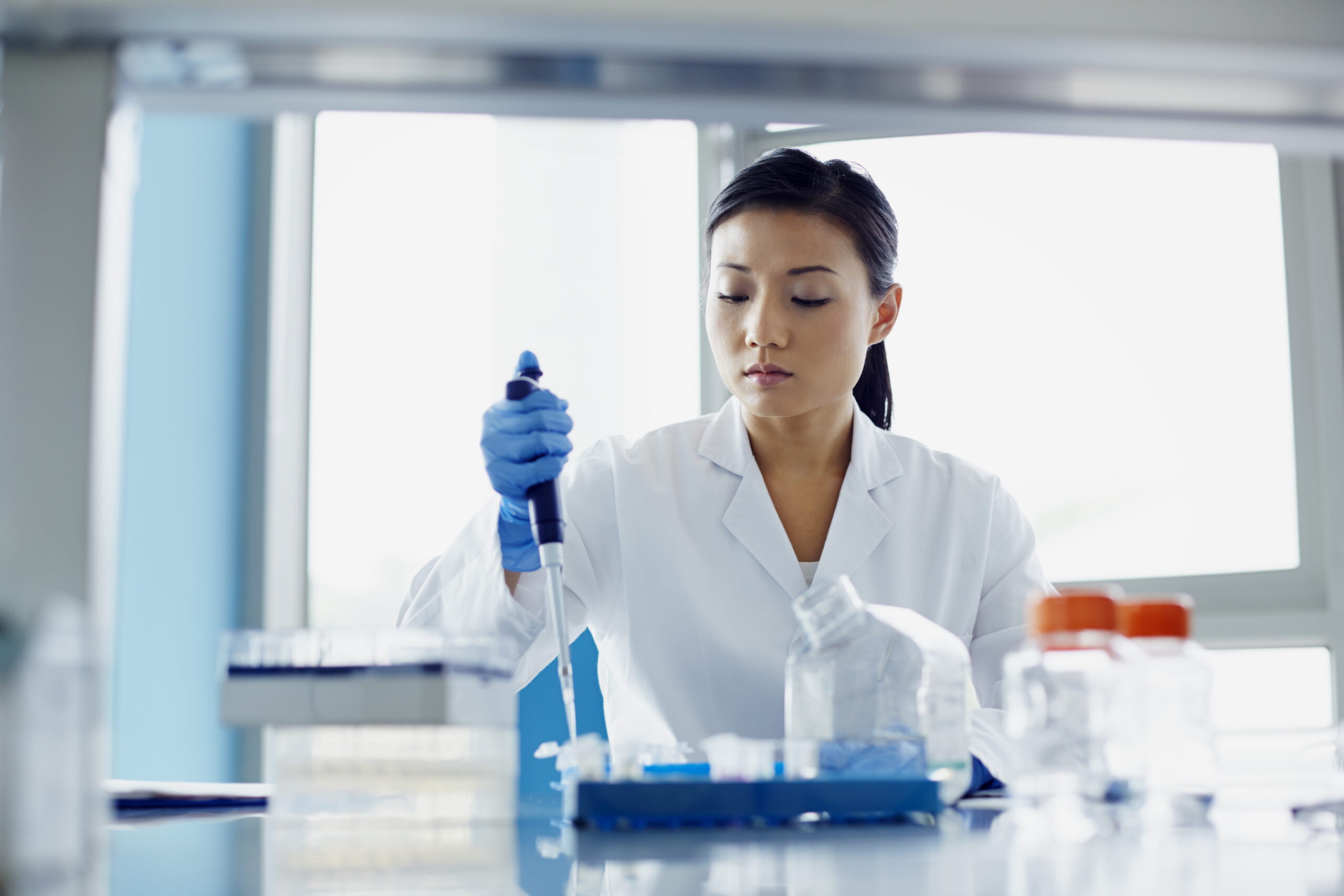 Researcher working in a lab on a new immunotherapy for lung cancer treatment option.