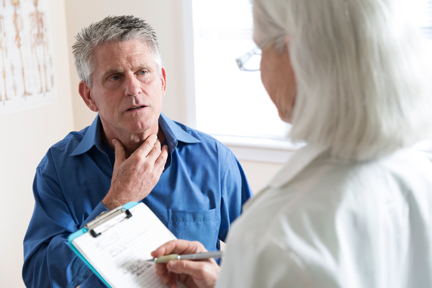 Man talking to doctor about lung cancer