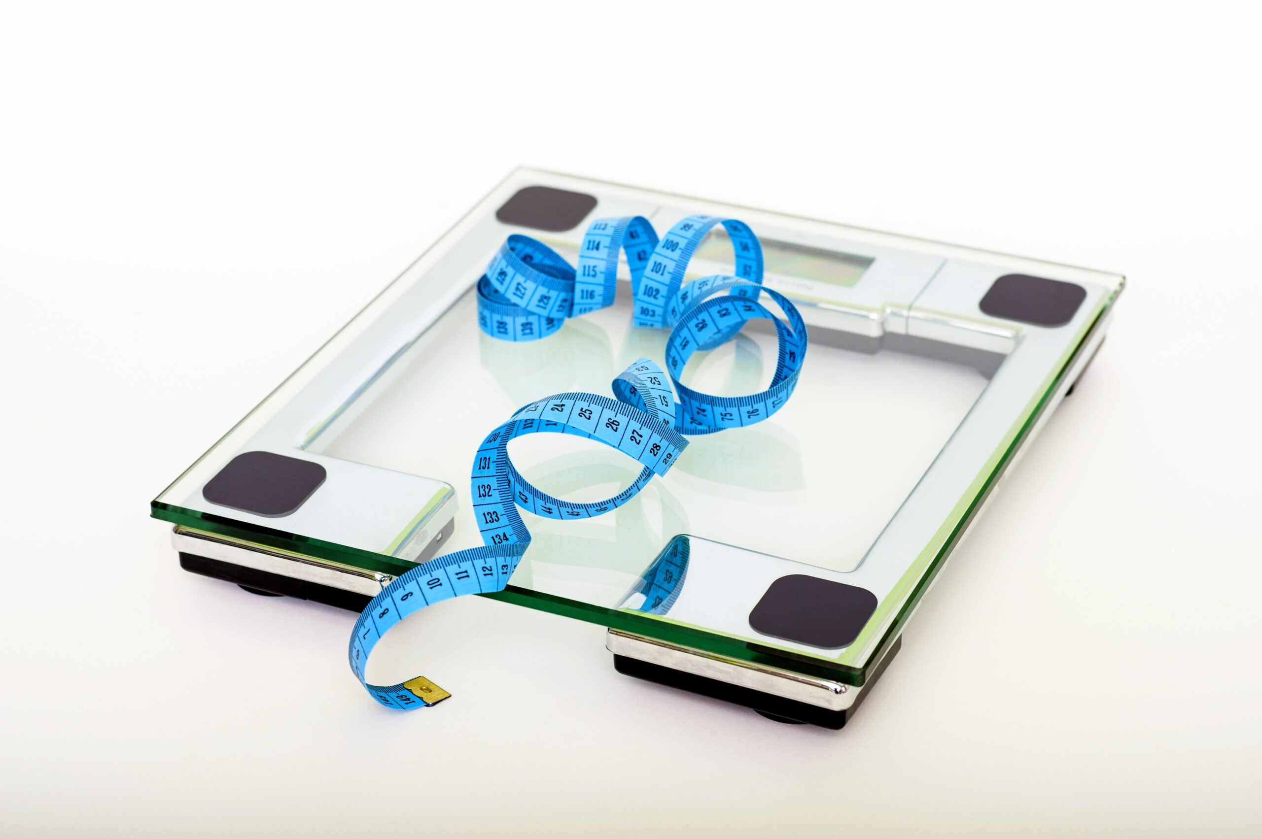 Blue tape measure on a glass scale