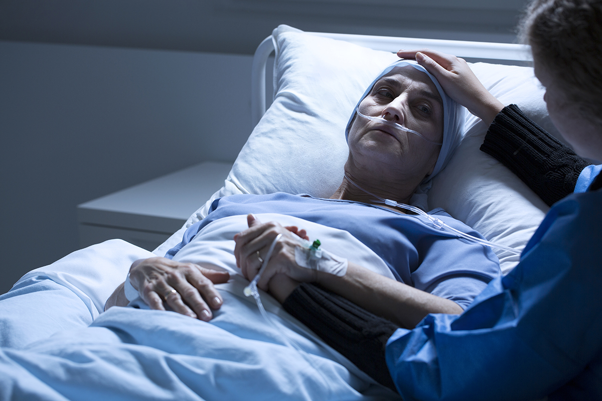 nurse assisting stage 4 mesothelioma patient.